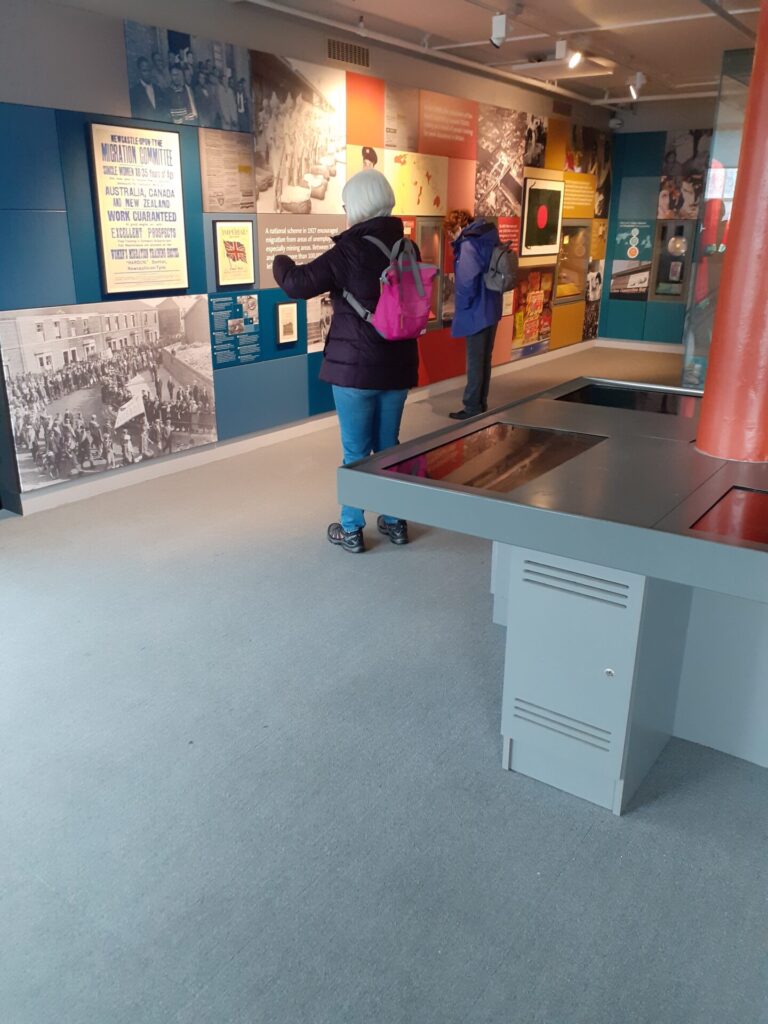 people looking at display in museum