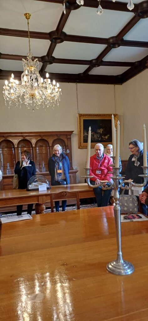 People listening to a tour guide